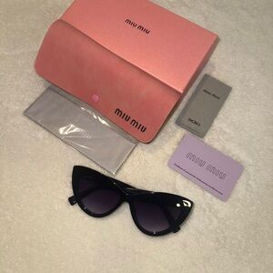 Miu Miu Black Cat-Eye Sunglasses with Purple Lenses